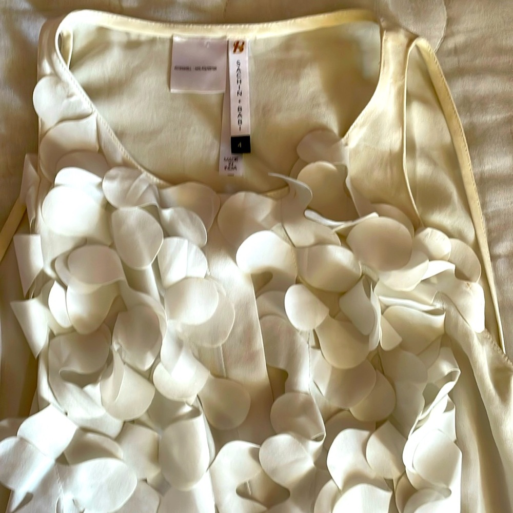 A beautiful cream blouse perfect for work or a chic night out.